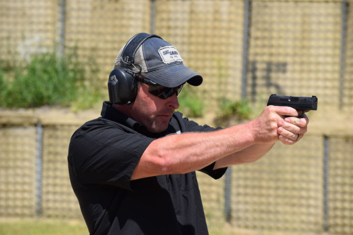 Student enrolled in the Covert Carry and Micro-Pistols Course in an aiming stance