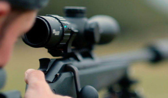 Close up of the SIERRA3BDX Riflescope being sighted on a rifle