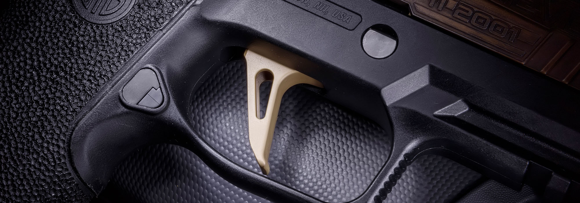 Guns & Ammo/SIG SAUER P320 FCU “Never Forget 9/11 Tribute” Pistol trigger close up